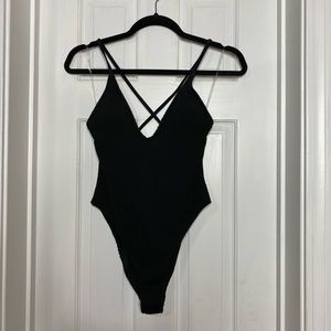 Textured black one-piece swimsuit
